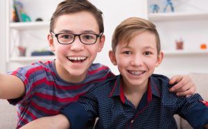 smiling children with and without braces 