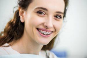 smiling girl with braces 