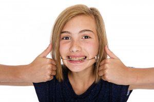 young girl with headgear