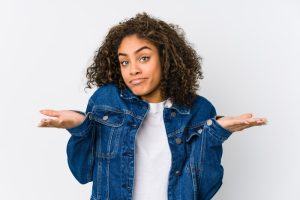 young woman shrugging 