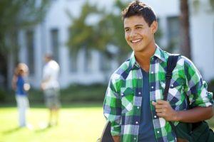 young boy at school with Invisalign TEEN 